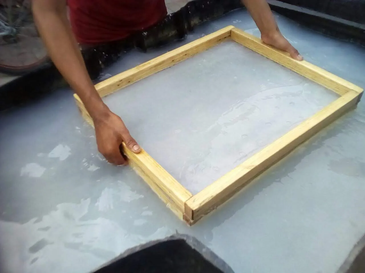 Making paper using wood deckles